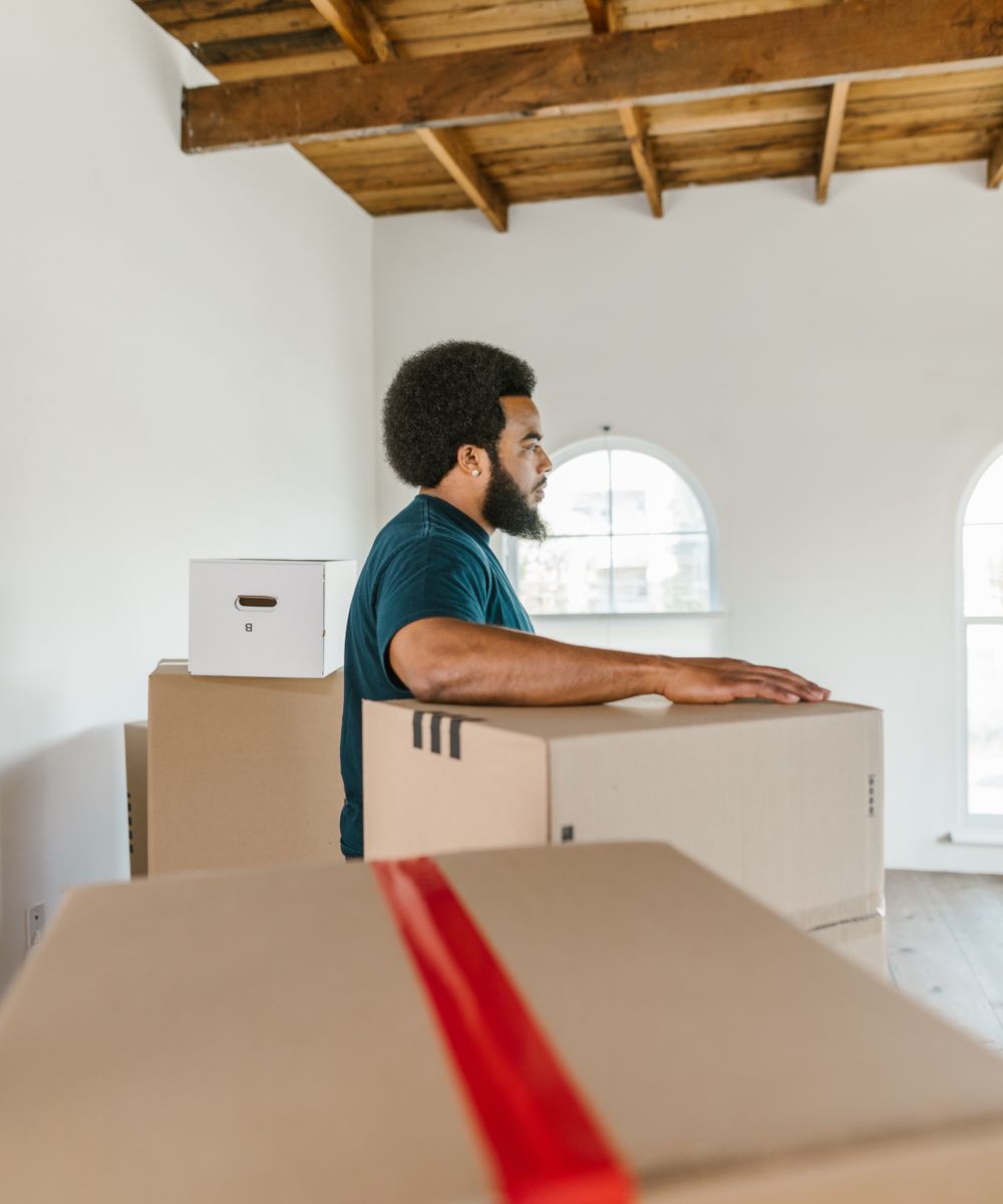 A 5 Stars Moving crew member with packed boxes